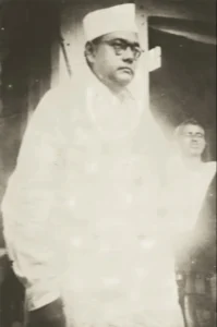 Subhas Chandra Bose speaking in Nabadwip, Subhas_Chandra_Bose_in_Nabadwip,_December_1938 December 1938. Photo by Amiya Gopal Dutta / Public Domain.